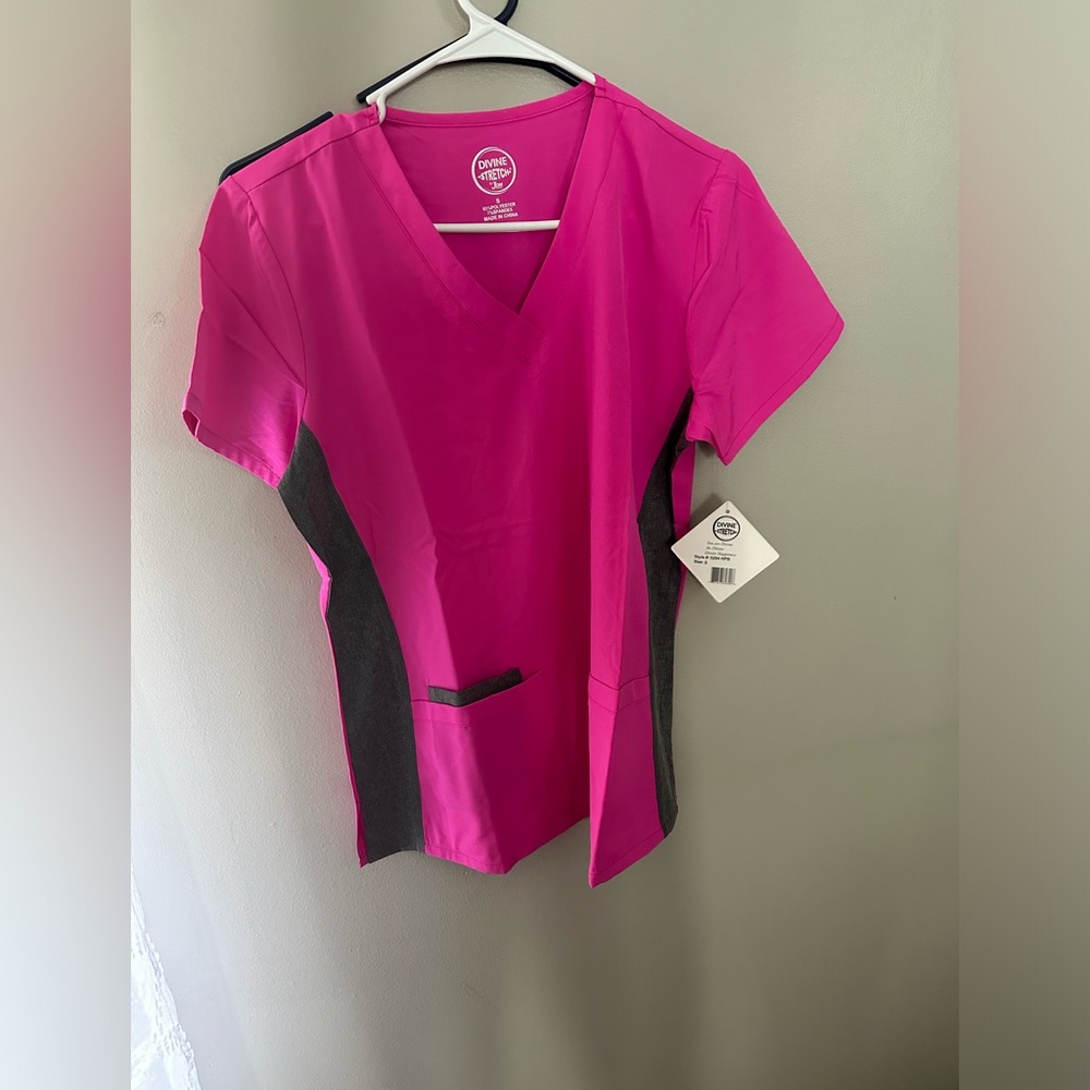 Pink scrubs with a grey strip down the sides
